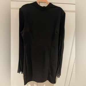 Black mini dress with cape sleeves